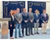 Foto de Gracia con Carlos Pollán y los miembros de la Mesa